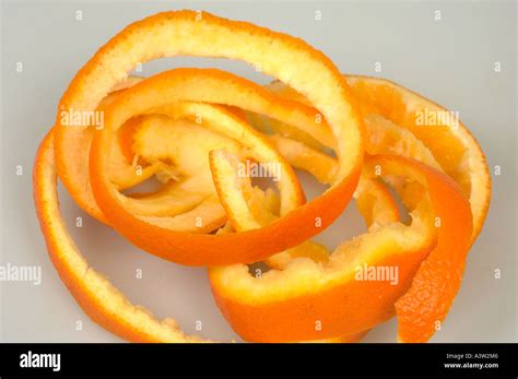 Orange fruit peel partially Stock Photo - Alamy