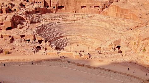 Tilt up aerial view ancient theater in Petra Rose City, Jordan. The city of Petra was lost for ...