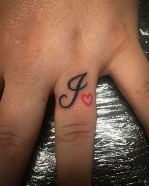 Initial Tattoo With Red Heart Outline On Ring Finger - Blurmark