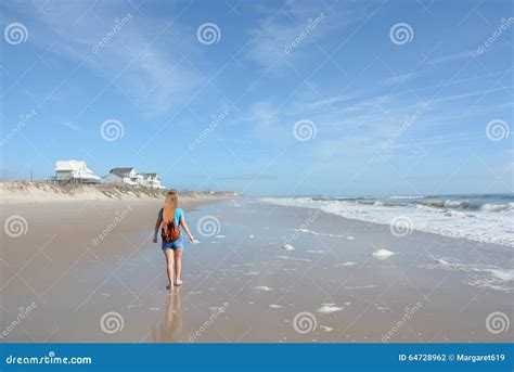 Girl hiking on the beach. stock photo. Image of girls - 64728962