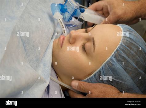 Female teenage patient under anesthesia during surgical procedure Stock ...