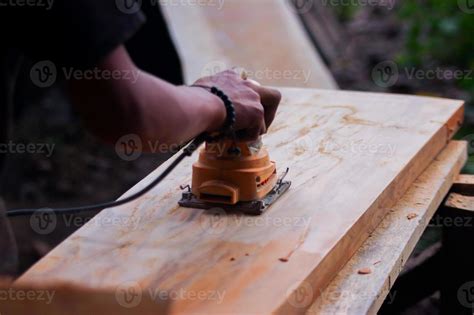 Sanding a wood 2543532 Stock Photo at Vecteezy