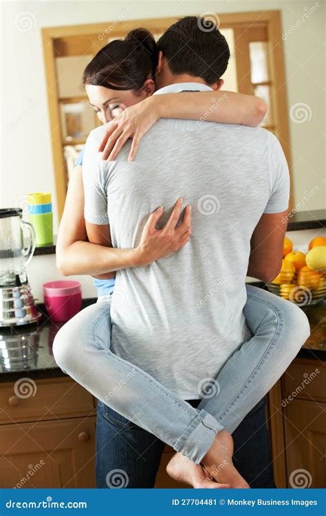 Romantic Couple Hugging In Kitchen Stock Image - Image of counter ...