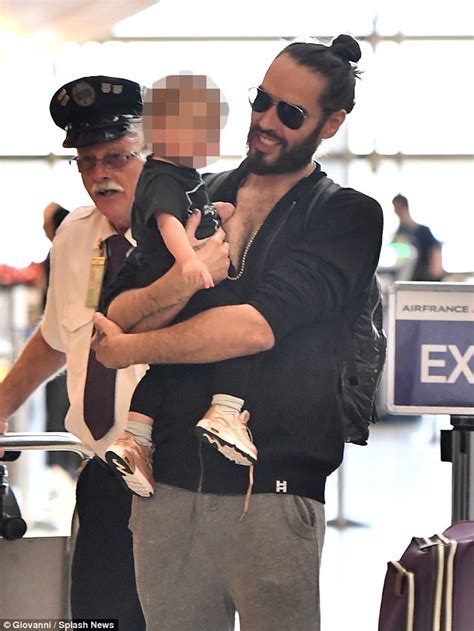 Russell Brand plays with daughter Mabel at airport | Daily Mail Online