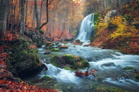 Beautiful waterfall in autumn forest ~ Nature Photos ~ Creative Market