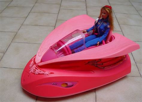 Barbie spaceship: pink. Of Course.