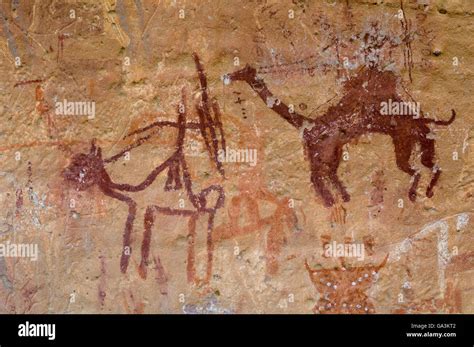 Prehistoric rock paintings, Akakus, Acacus Mountains or Tadrart Acacus, Sahara desert, Fezzan ...