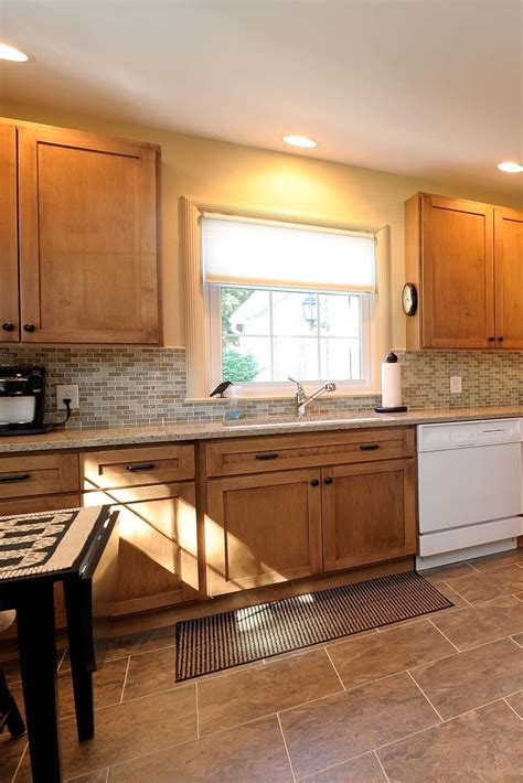 Light Wood Kitchen Cabinets with Mosaic Tile Backsplash