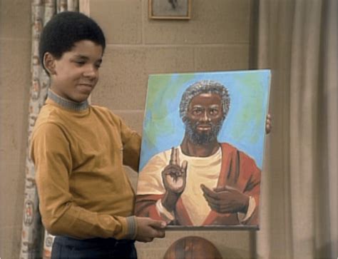 Michael Evans holds J.J.'s painting of Black Jesus. Screenshot captured ...