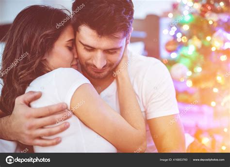 Romantic Couple Hug Christmas Tree Stock Photo by ©DPimage 416853760