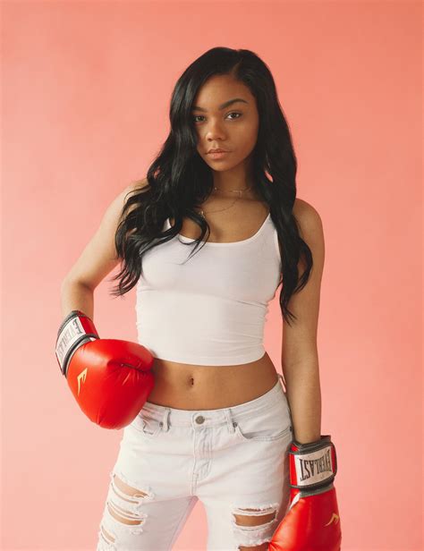 Woman Wearing White Tank Top and Red Boxing Gloves · Free Stock Photo