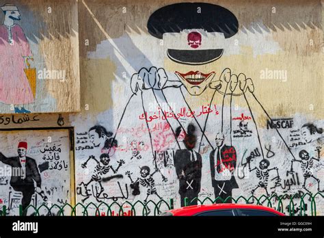 Egypt, Cairo, graffiti of the Egyptian revolution on Mohamed Mahmoud Street. The puppetmaster ...