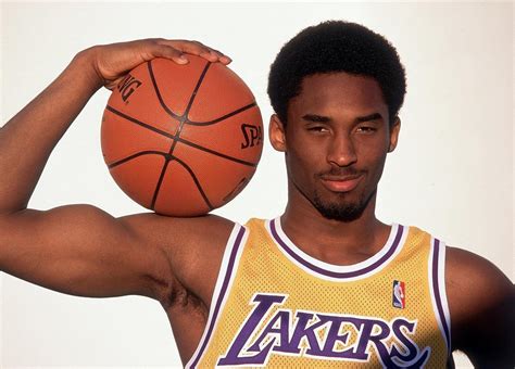Kobe Bryant shows off his guns during this 1998... - SI Photo Blog