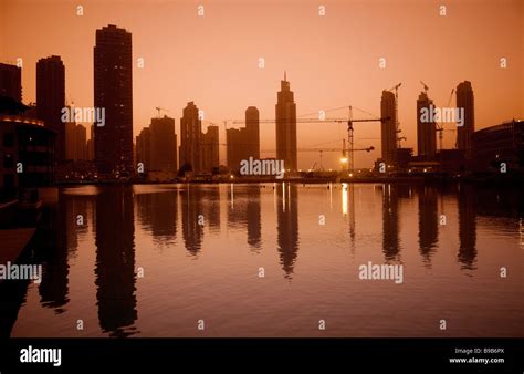 dubai city skyline at sunset Stock Photo - Alamy