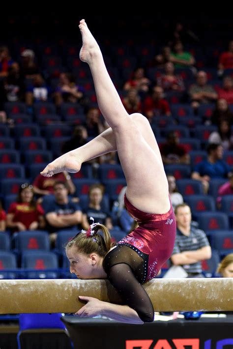 University of Denver gymnast Leah Lomonte mounts the beam. Photo taken on March 14, 2015, at the ...