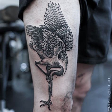 The Dotwork Head Down Crane Tattoo by Maxime Buchi shows how this bird looks for food… or maybe ...