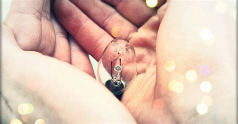 Centered Clear Bulb on Human Hand · Free Stock Photo