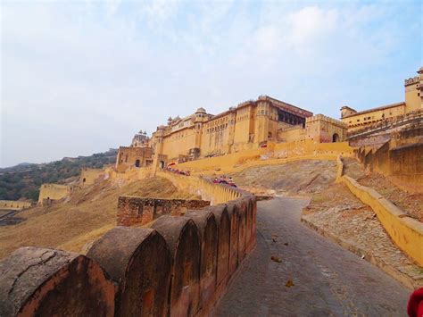 Amer fort is a beautiful palace built from yellow and pink sandstone ...