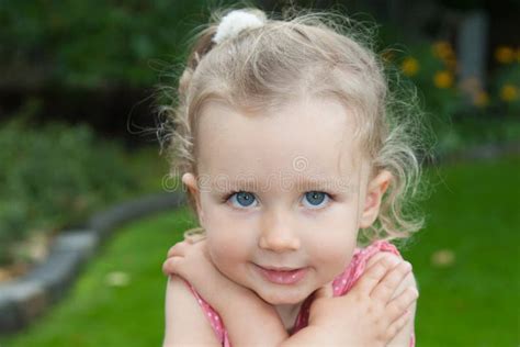 Blond Child Girl Posing Outdoor with Blue Eyes Stock Photo - Image of beauty, blond: 124398762