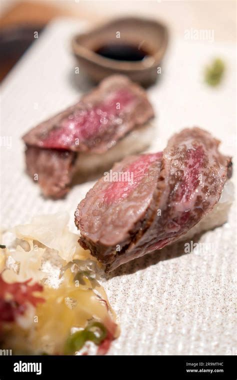 Japanese raw beef sushi with rice in Tokyo Japan Stock Photo - Alamy