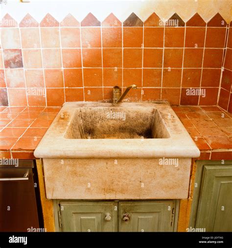 Distressed kitchen sink Stock Photo - Alamy