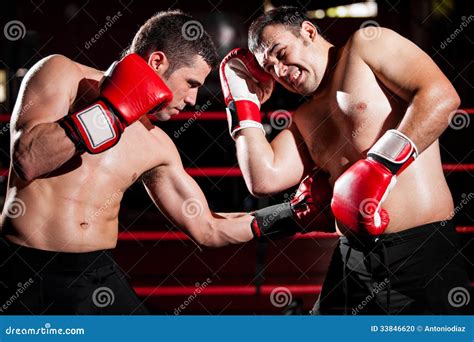 Throwing A Hook On A Boxing Fight Stock Photo - Image of gloves, competitor: 33846620