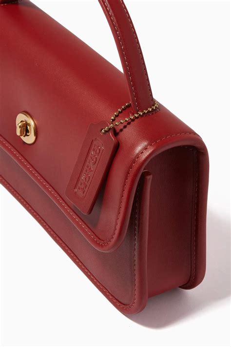 Shop Coach Red Turnlock Clutch Bag in Leather for Women | Ounass UAE