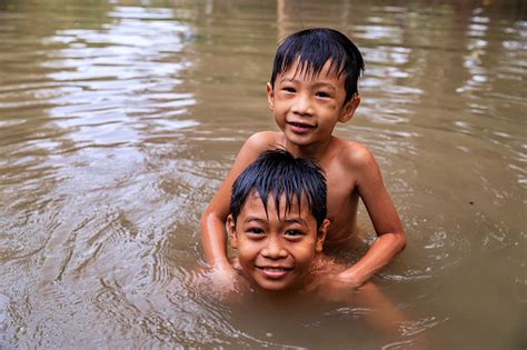 Two Little Vietnamese Boys Bathing In Mekong River Delta Vietnam Stock Photo - Download Image ...