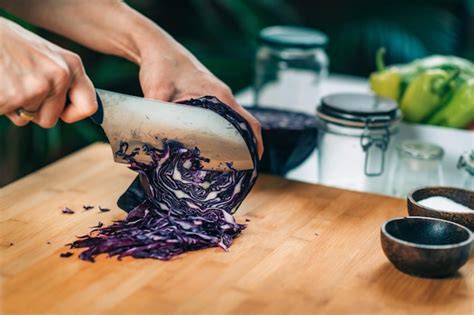 Premium Photo | Fermentation process woman preparing vegetables for fermentation at home cutting ...