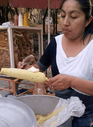 Mexican street food favourite: Hot corn on the cob smothered in mayonnaise, chili, lime and ...