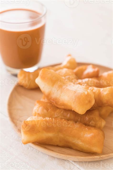 Deep-fried dough stick with milk tea on wood 3109016 Stock Photo at ...