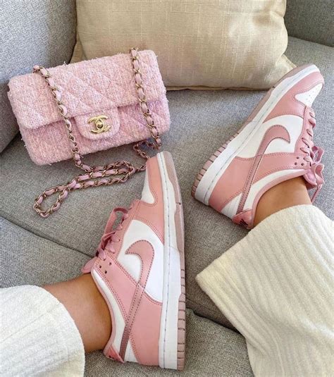 The Nike Dunk Low Pink Velvet features a white leather base upper with ...