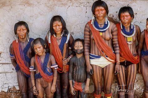 Kayapo people with red paints on their face. | Brazilians, Style, Photo