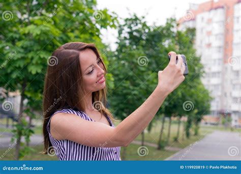 Young Female Holding Phone for Picture Stock Image - Image of hair, lovely: 119920819