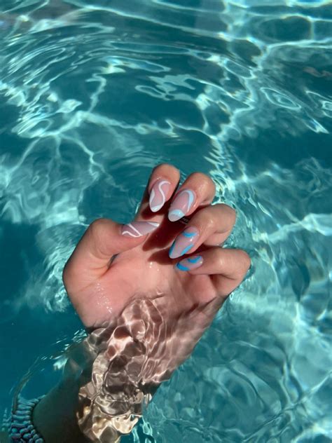 Blue acrylic nail design with white nail design and light blue nail design dark blue nail design ...