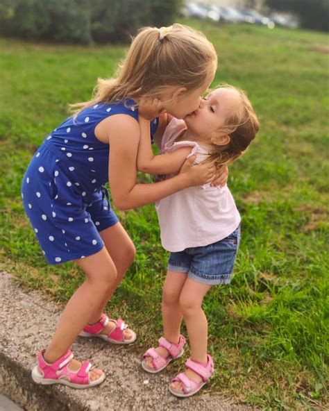 adorable sisters kissing each other | Cute little girl dresses, Little ...