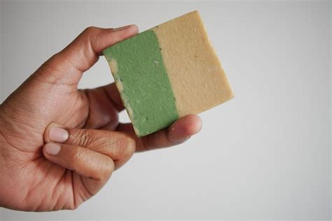 Premium Photo | Holding a natural soap bar