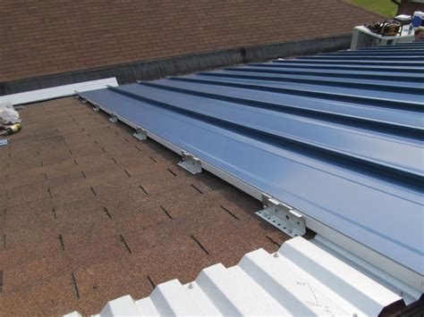 How to Install Metal Roofing Over Shingles