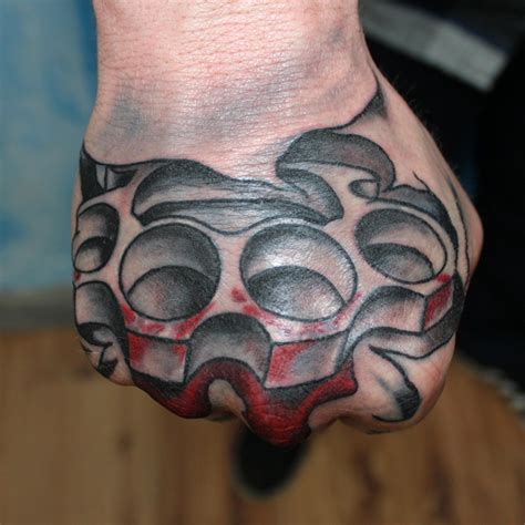 Brass Knuckles Tattoo On Hand