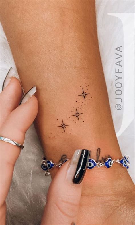 Tiny Stars Tattoo | Wrist tattoos for women, Tattoos for women, Discreet tattoos