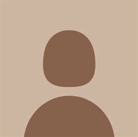 an image of a person's face in the middle of a brown and tan background