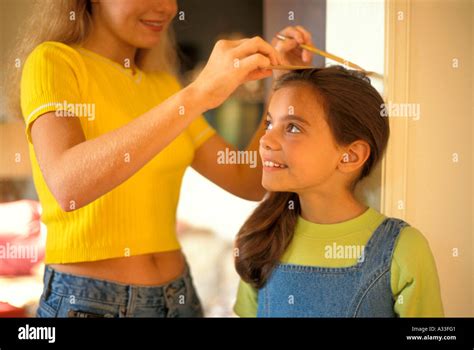 Girl get her height measurement 4FF Stock Photo - Alamy