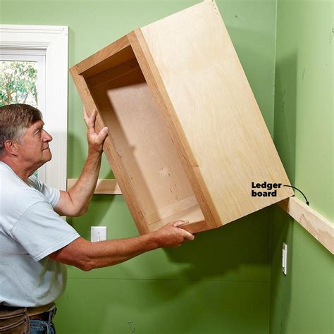 How to Install Cabinets Like a Pro — The Family Handyman How To Install Kitchen Island ...