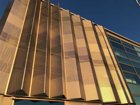 Folded perforated panels provide shade and look great. | Facade architecture, Metal facade ...