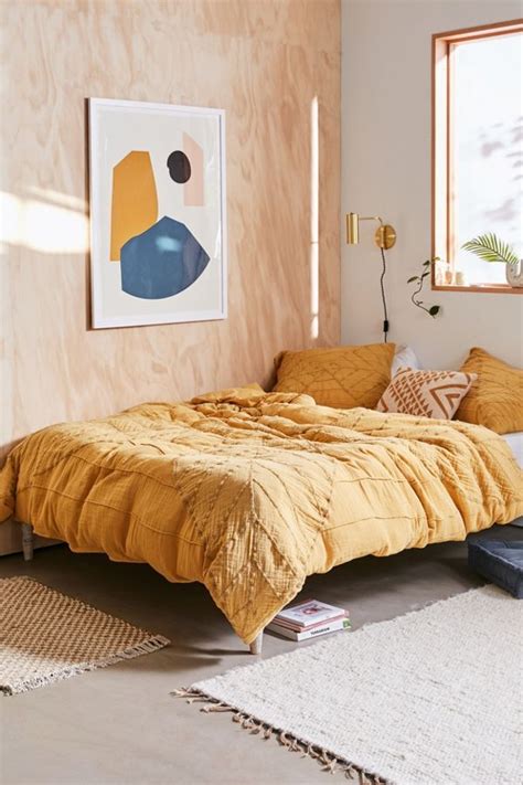 A sunny dreamy bedroom with plywood wall - Daily Dream Decor