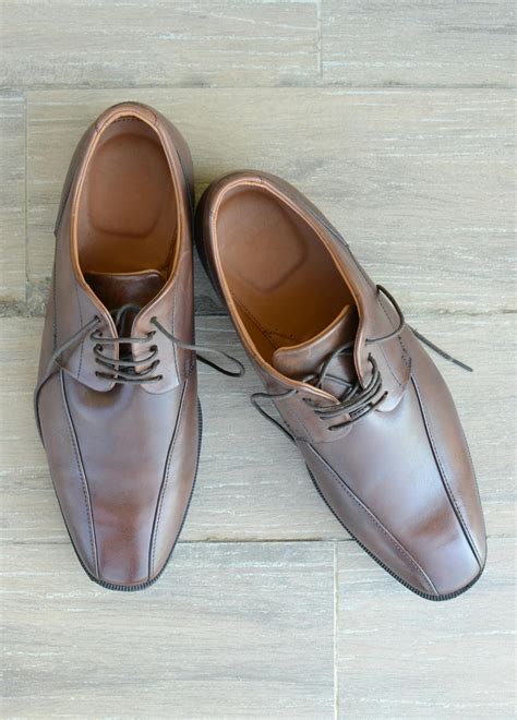 Pair of Brown Leather Dress Shoes Placed on Gray Surface · Free Stock Photo