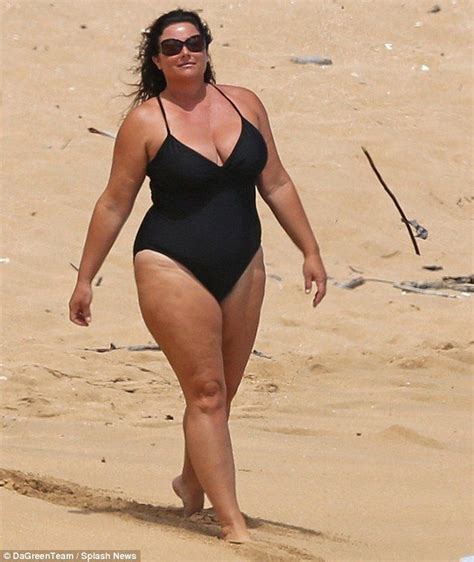 Love her curves Pierce Brosnan takes a dip in the sea to cool off during romantic beach day with ...