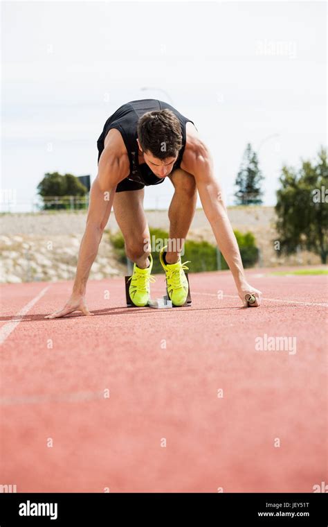 Athlete ready to start the relay race Stock Photo - Alamy