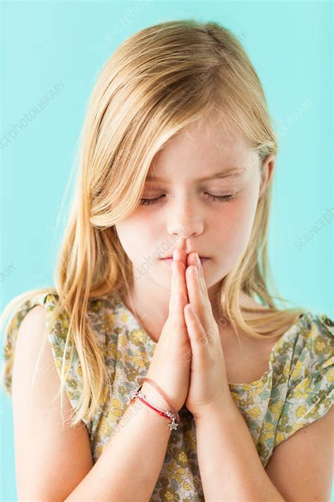 Child praying - Stock Image - C033/2516 - Science Photo Library