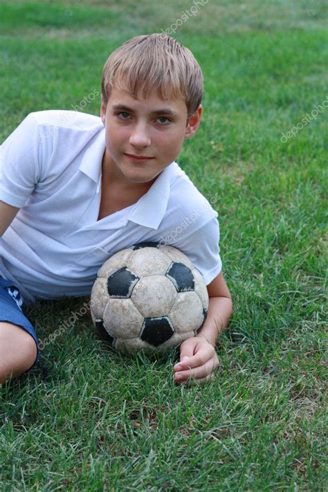 Boy with old soccer ball — Stock Photo © AlexSmith #3674386